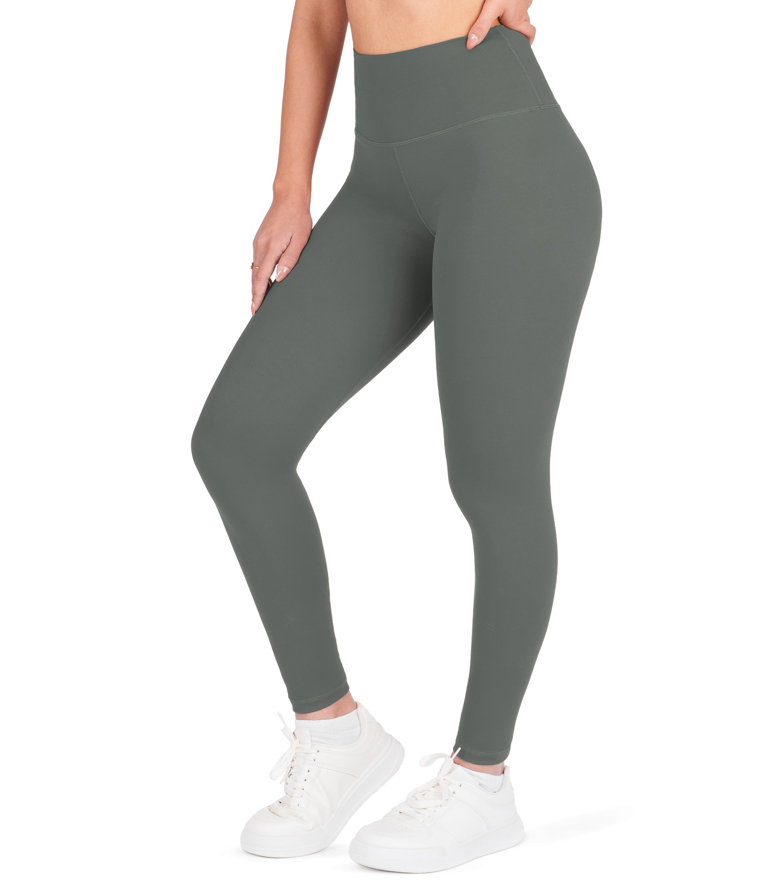 Front view of woman wearing NirLUX high waist ankle leggings in grey sage