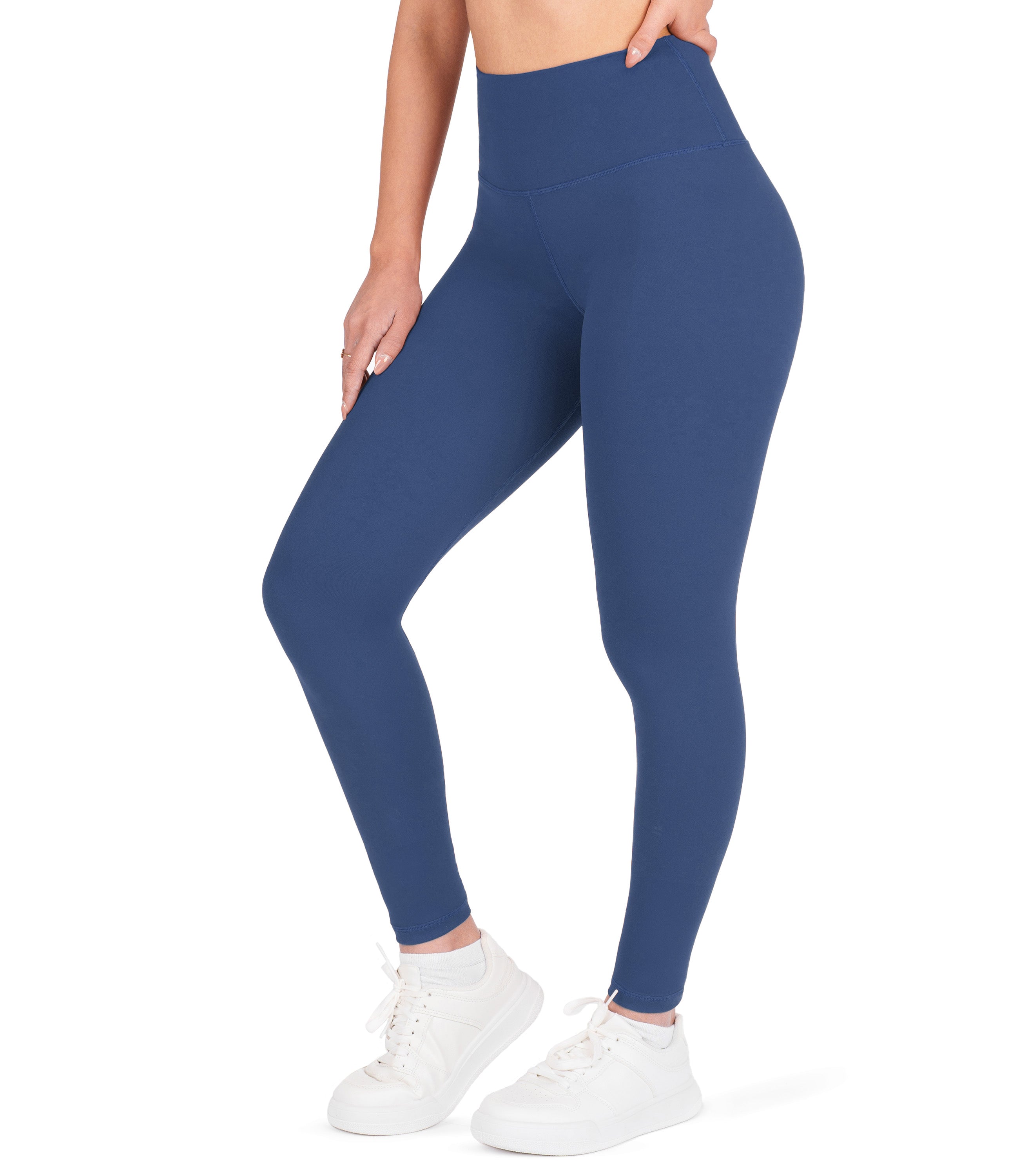 Front view of woman wearing NirLUX high waist ankle leggings in limoges navy
