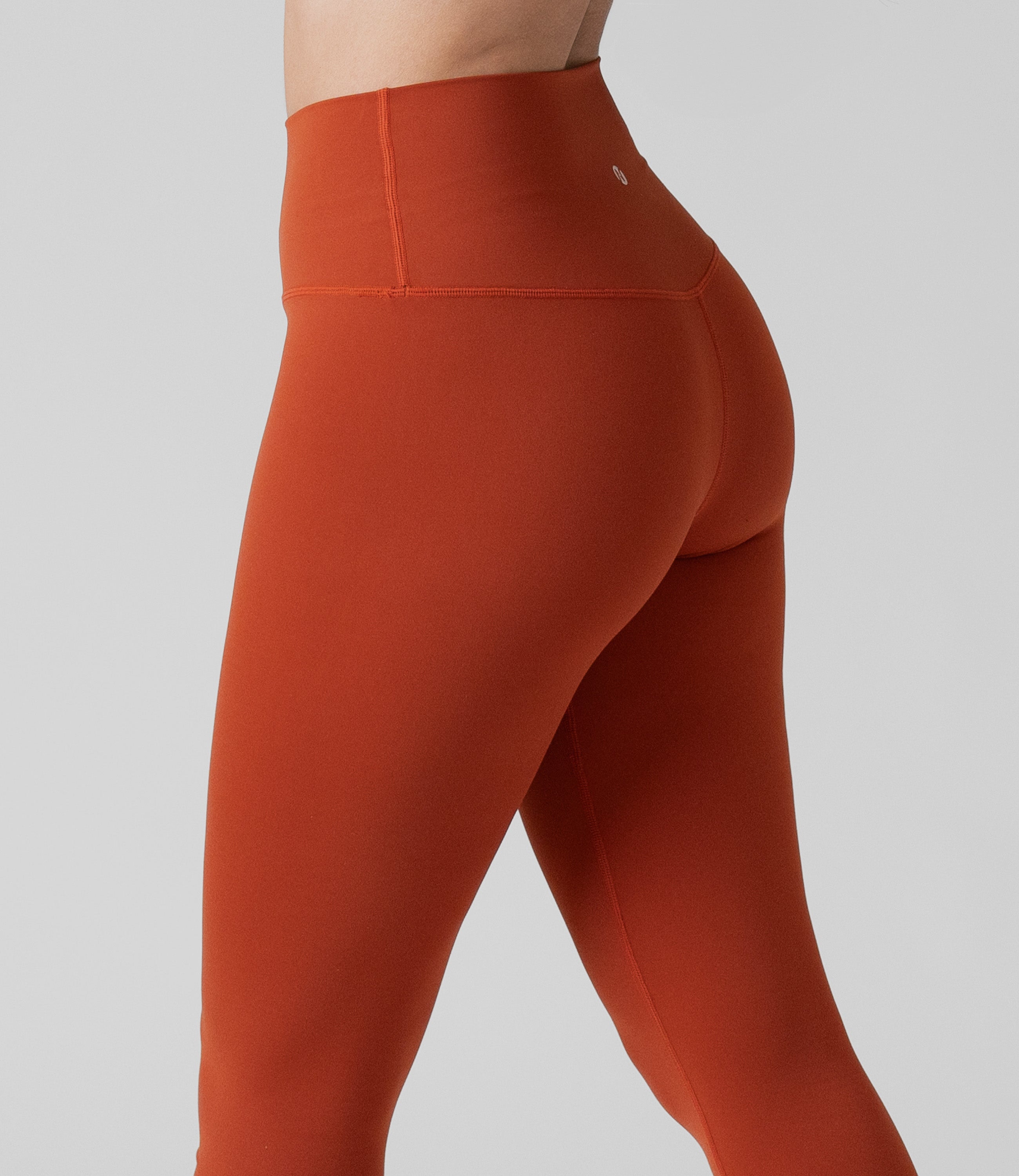 Back view of NirLUX high waist leggings for women in intense rust, showing tummy control fit