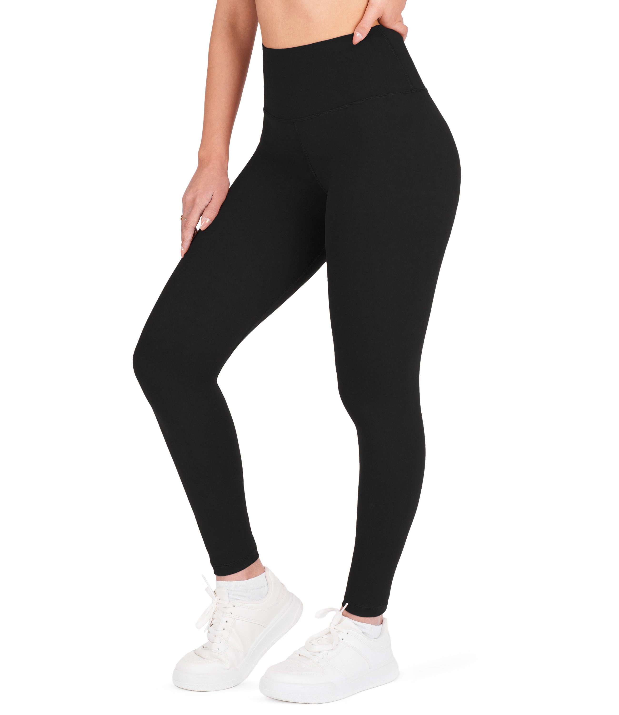 Front view of woman wearing NirLUX high waist ankle leggings in black