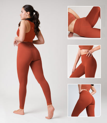 Model wearing NirLUX tummy control leggings in intense rust, showcasing high-rise fit