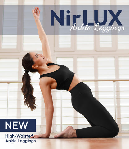 Woman wearing NirLUX yoga leggings in black, full-body view