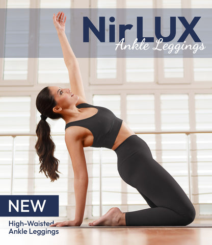 Woman wearing NirLUX yoga leggings in grey rabbit, full-body view