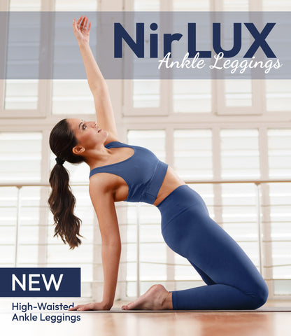 Woman wearing NirLUX yoga leggings in limoges navy, full-body view